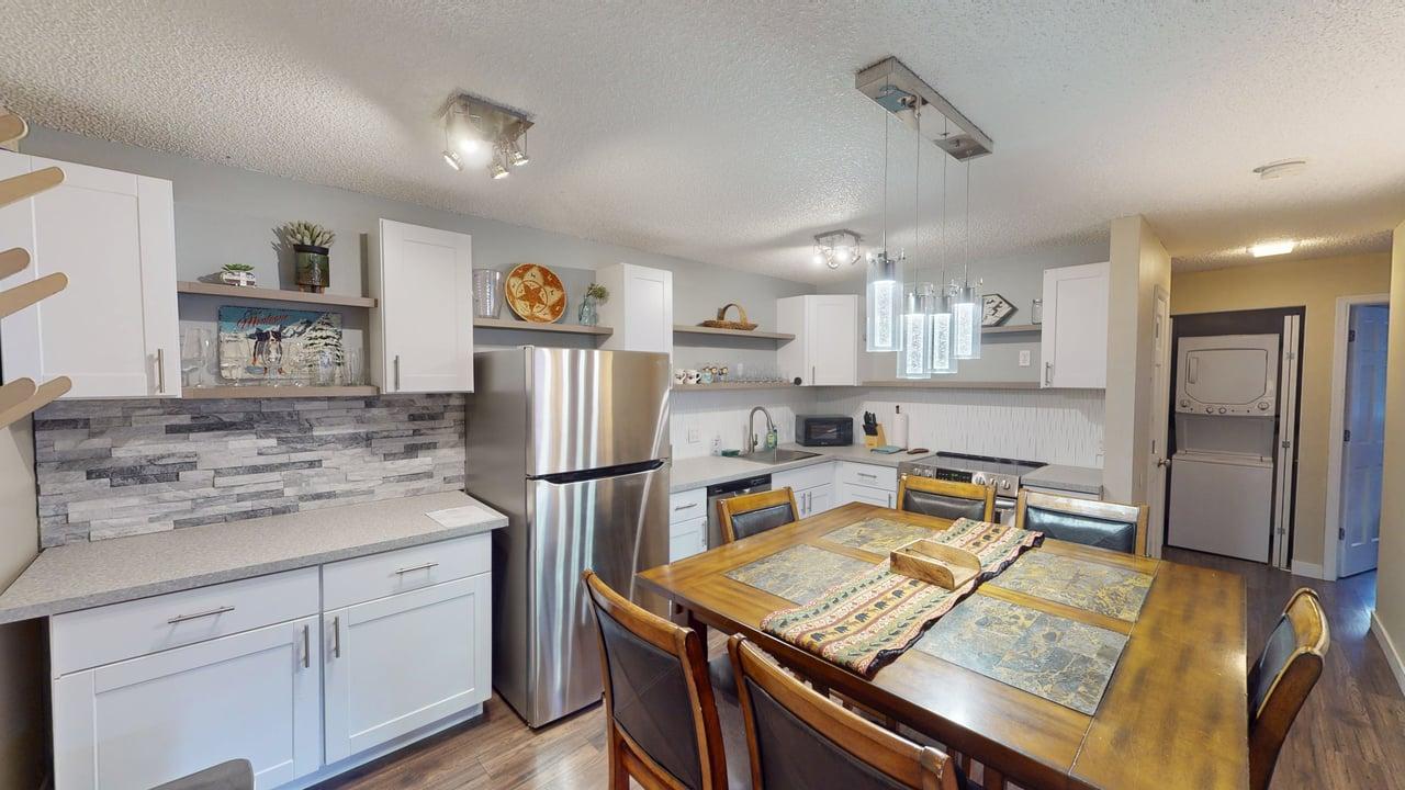 This inviting space is perfectly designed and set up to be the ideal location for enjoying delicious meals, whether it's a casual breakfast, an elegant dinner, or a fun family gathering.