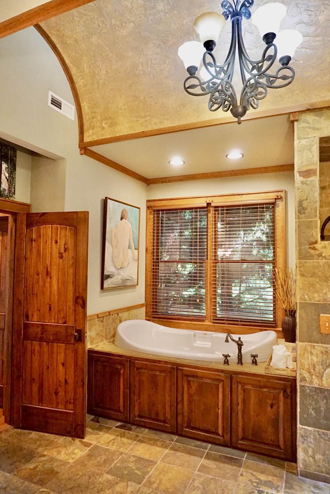 Soak away your stress in this serene bathroom retreat.