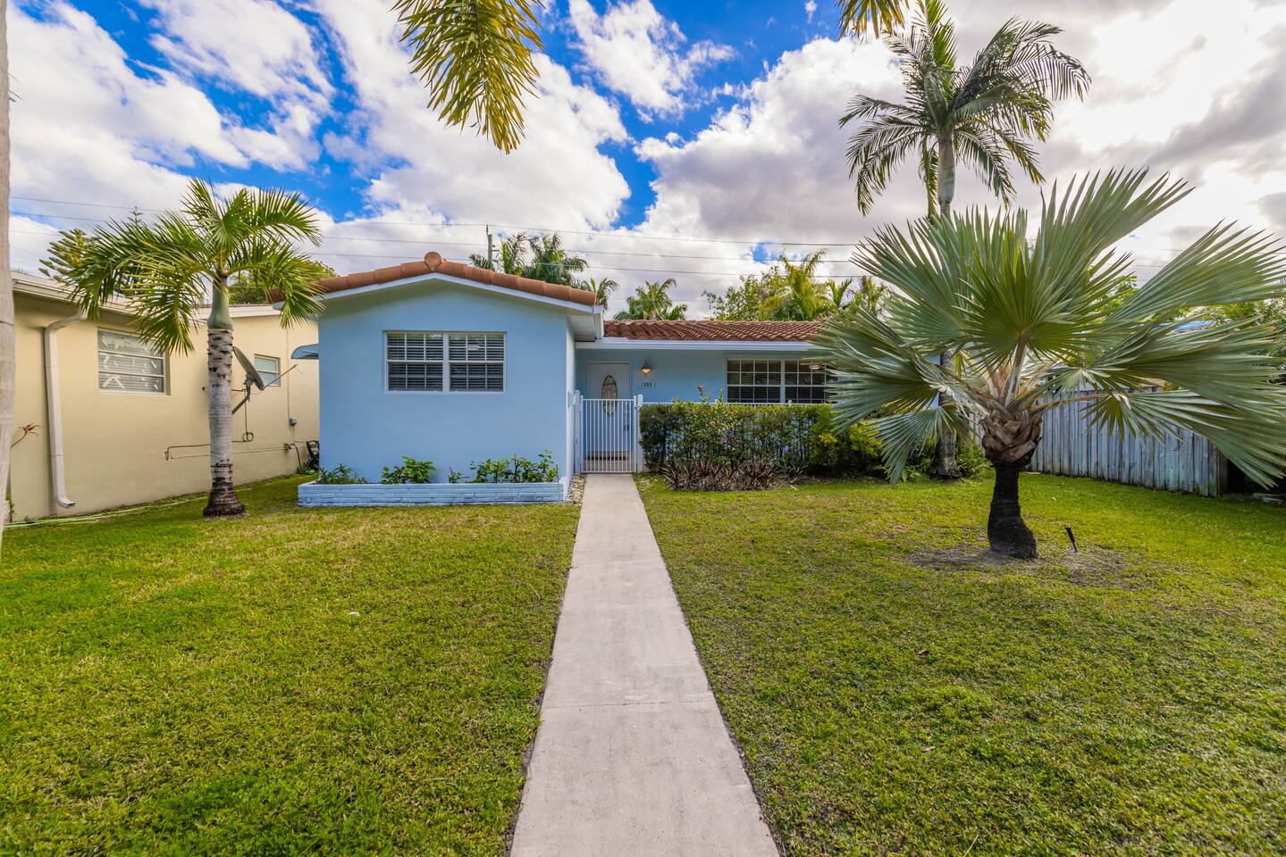 Just a 5 minute walk to Hollywood Beach Boardwalk is this lovely Bungalow tucked in a safe family-friendly neighborhood