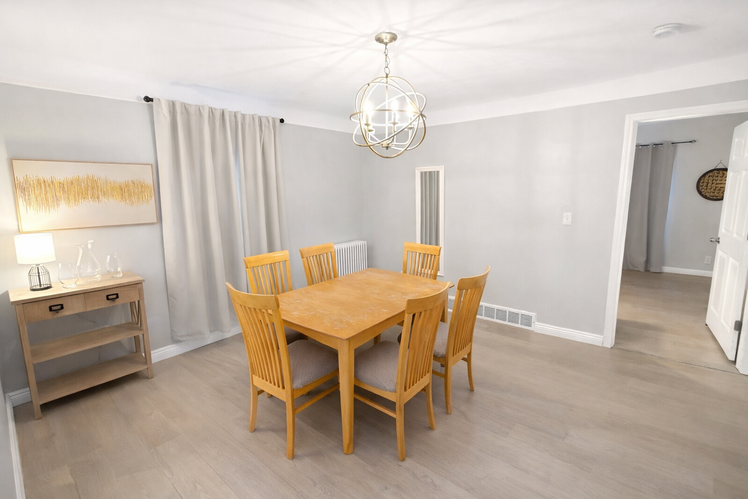 The dining room is decorated in a warm and inviting style, perfect for a cozy meal.