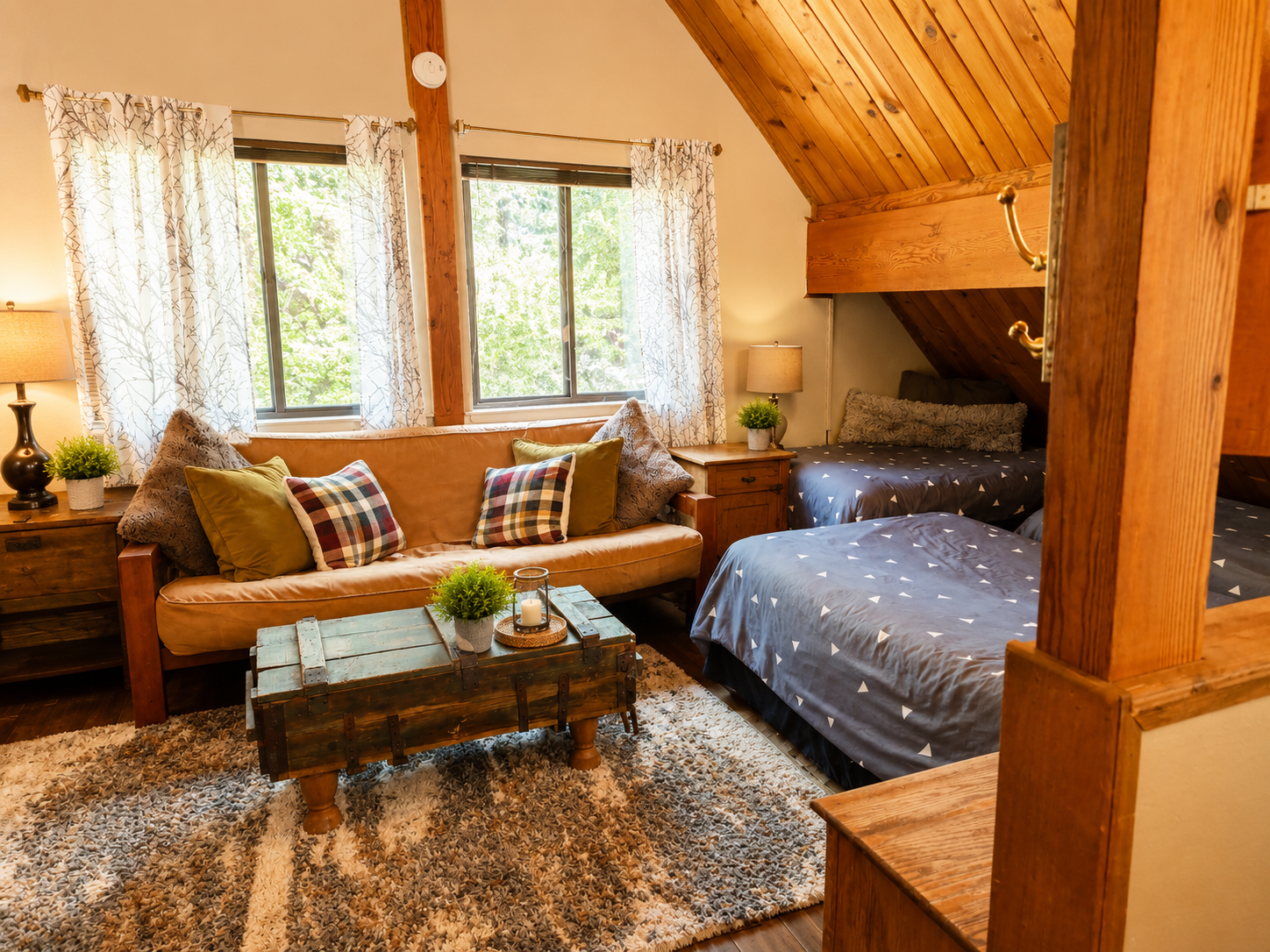 Our upstairs loft area is a great place for your group to spread out.  There are four beds and a seating area with tv, so it can be a second living spot as well as a sleeping area for a larger group.  It's a great place to let the kids hang out!