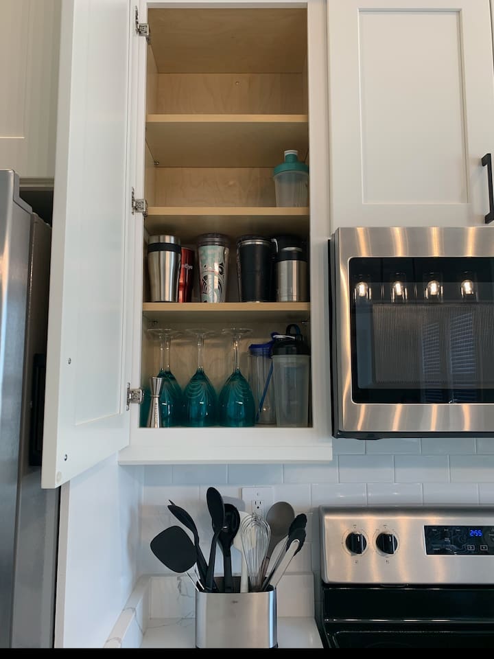 Assortment of insulated cups and additional wine glasses.  