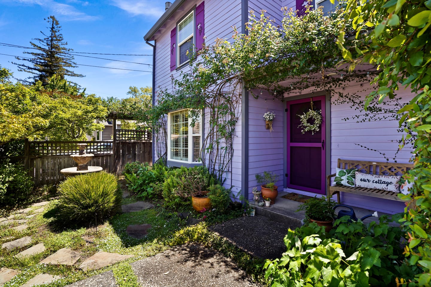 Charming front yard with a peaceful fountain, creating a warm welcome as you arrive.
