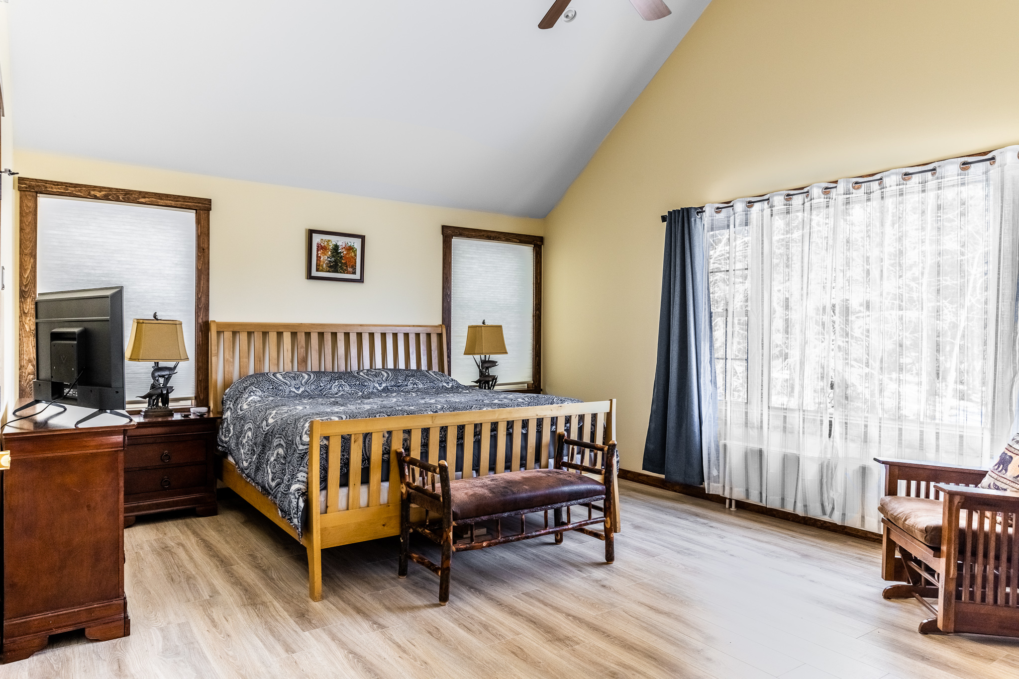 Main floor bedroom with king bed and ensuite bathroom