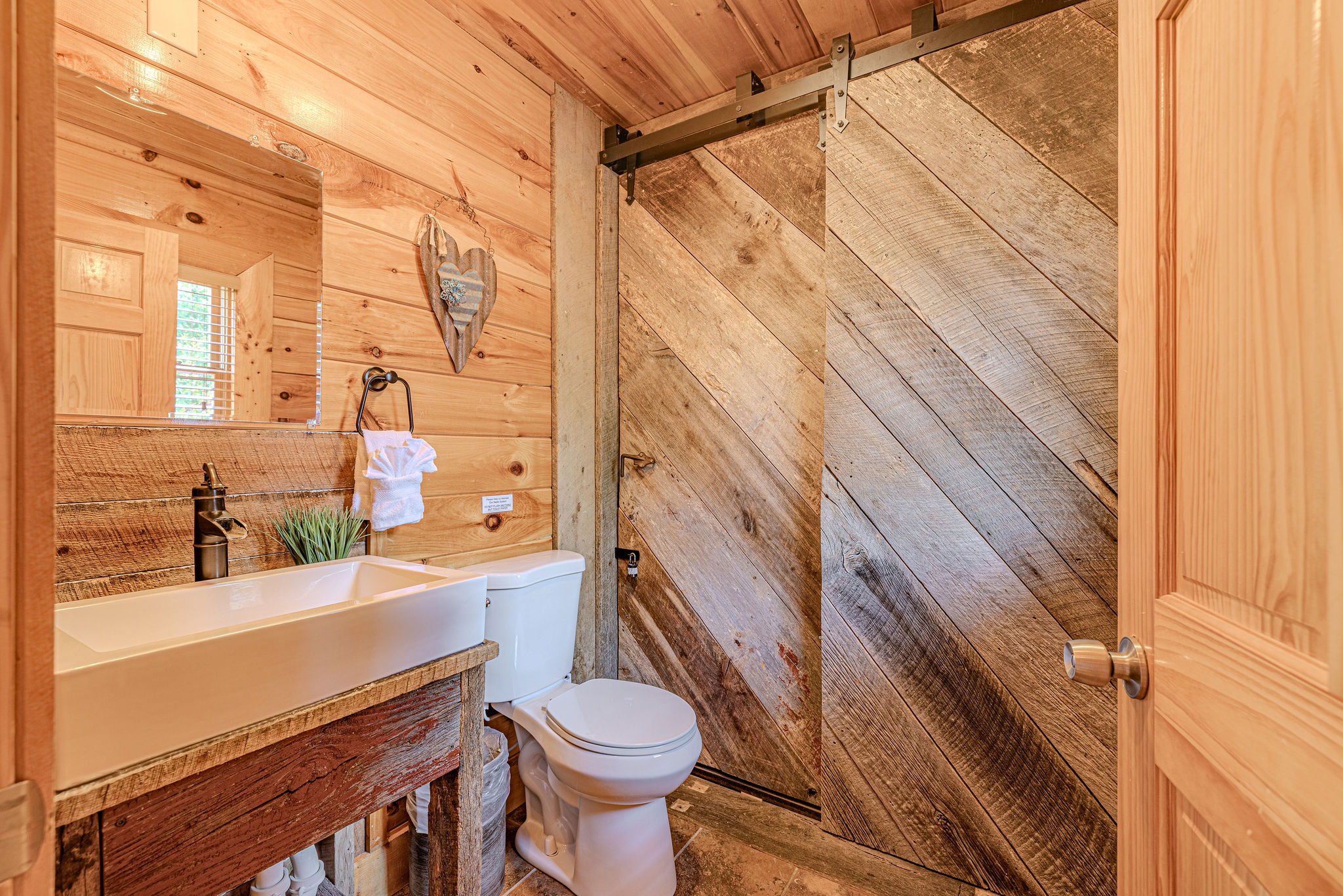 Convenient main floor half bath. Easy access with a cozy cabin feel.