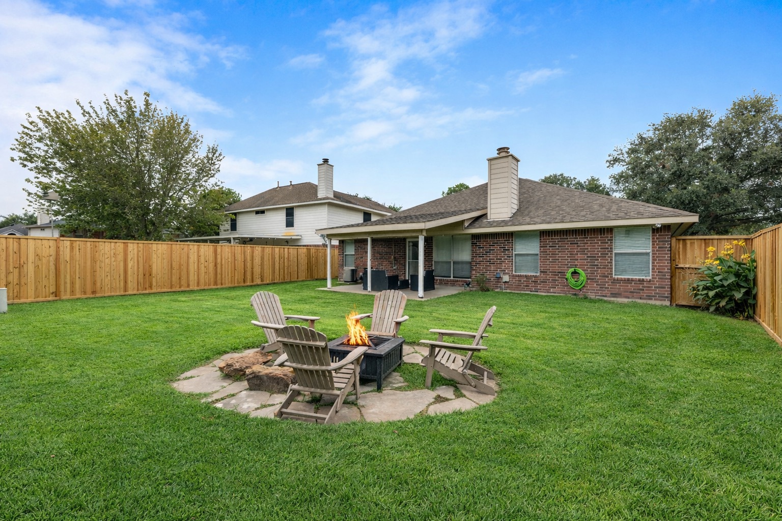 Cozy evenings under the stars around the fire pit with comfortable seating.