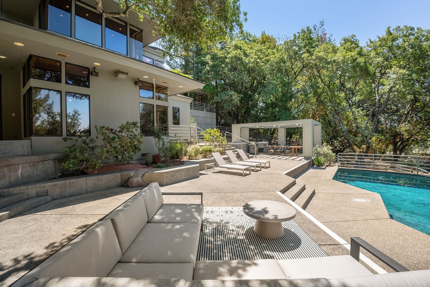 The large outdoor space has plenty of options, from the comfy section to 6 pool loungers to the 12-person outdoor dining table.