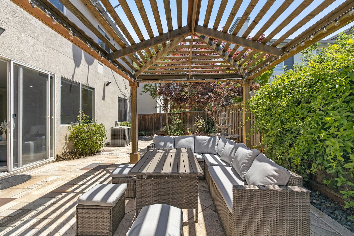 Relax and enjoy the outdoors  in this charming backyard.