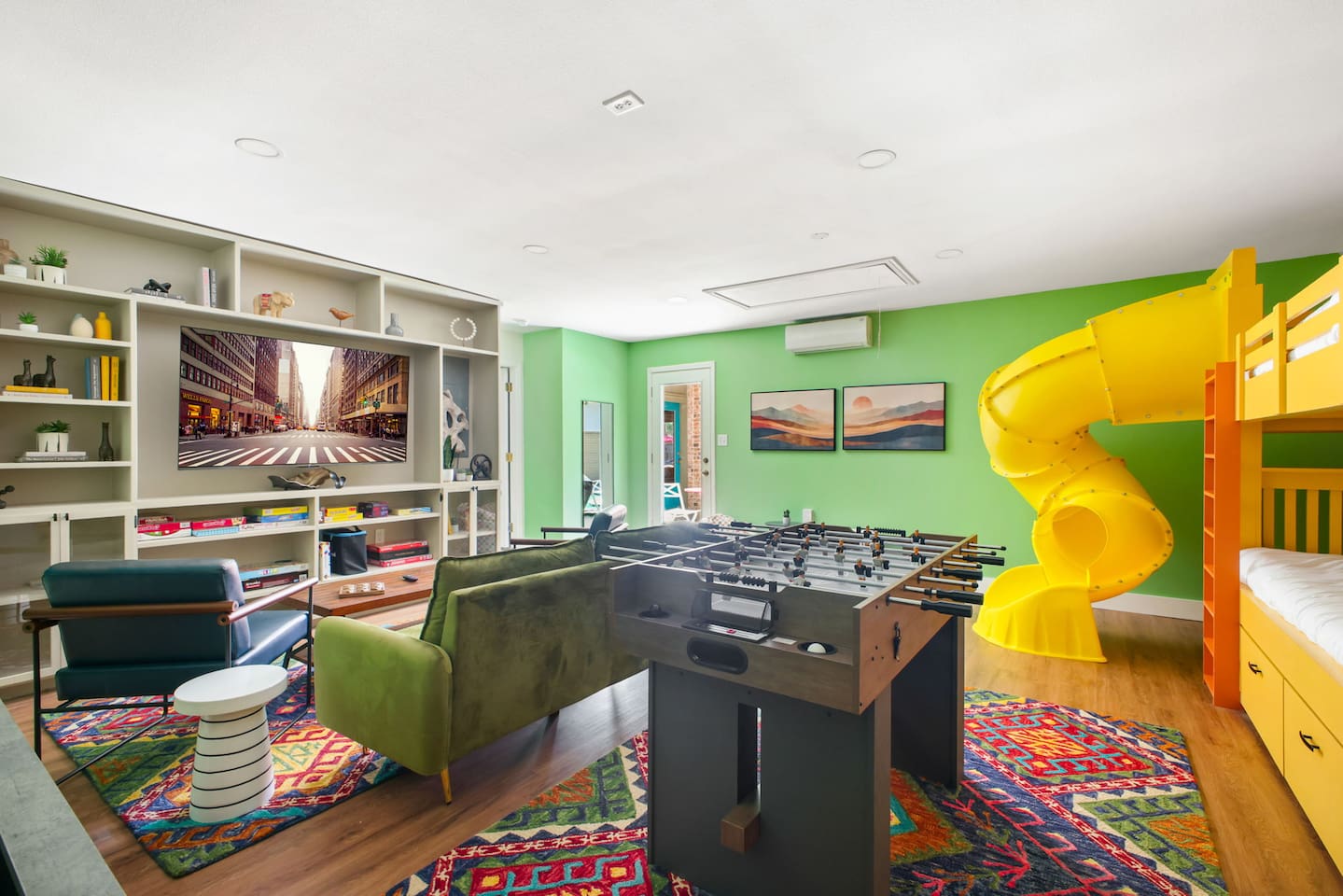  Foosball, shuffleboard, and a slide — the ultimate kids’ hangout.