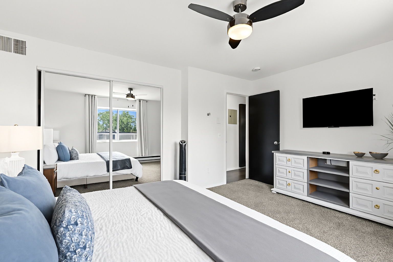 Enjoy a restful stay in a beautifully designed space featuring a king bed and a striking modern wood accent wa