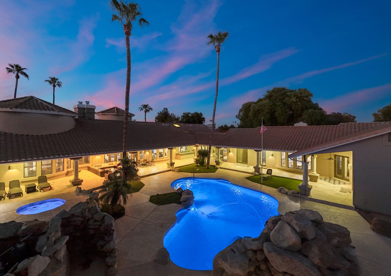 Framed by towering palms and elegant architecture, this poolside courtyard feels like a five-star retreat.

