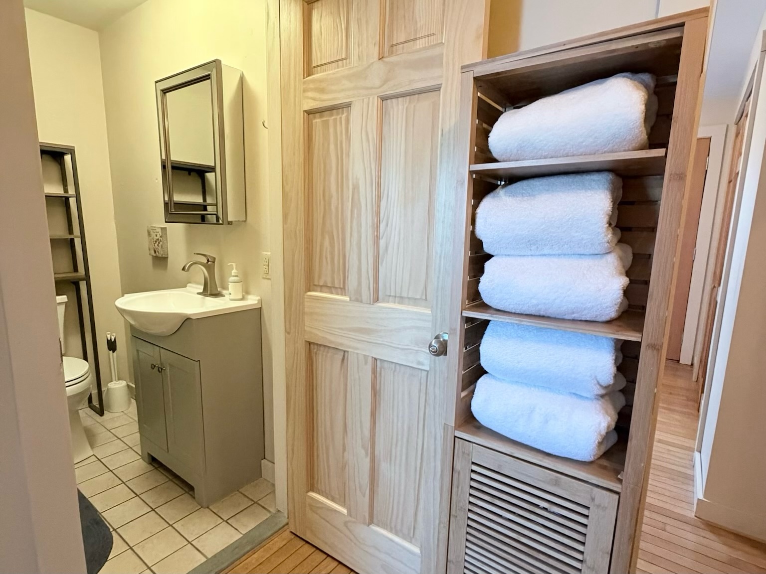 High quality white linens and professional styling create a serene atmosphere in the master suite.