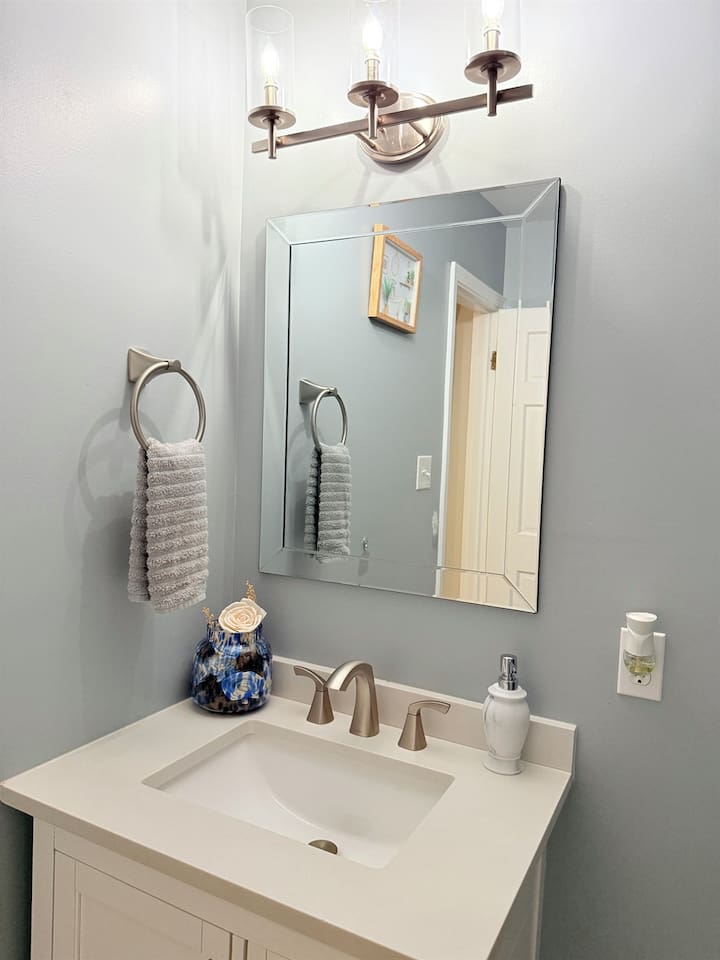 Ensuite bathroom with double towels and neutral tones — clean, simple, and calming. 