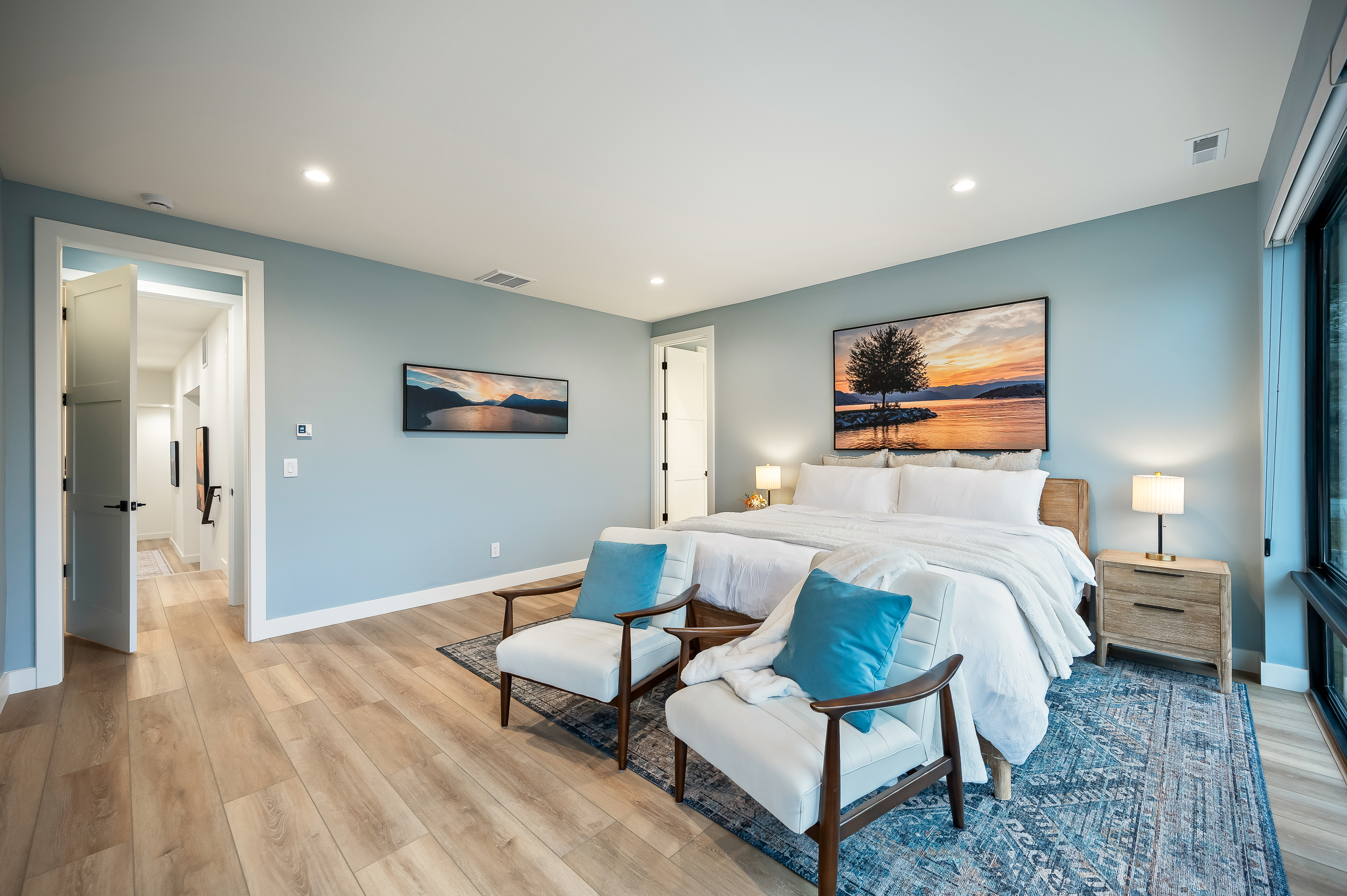 Primary: Bedroom #6 of 7 - Upstairs, king bed, Smart TV, large walk-in closet with crib, and en suite with soaking tub, walk-in shower, and lake views