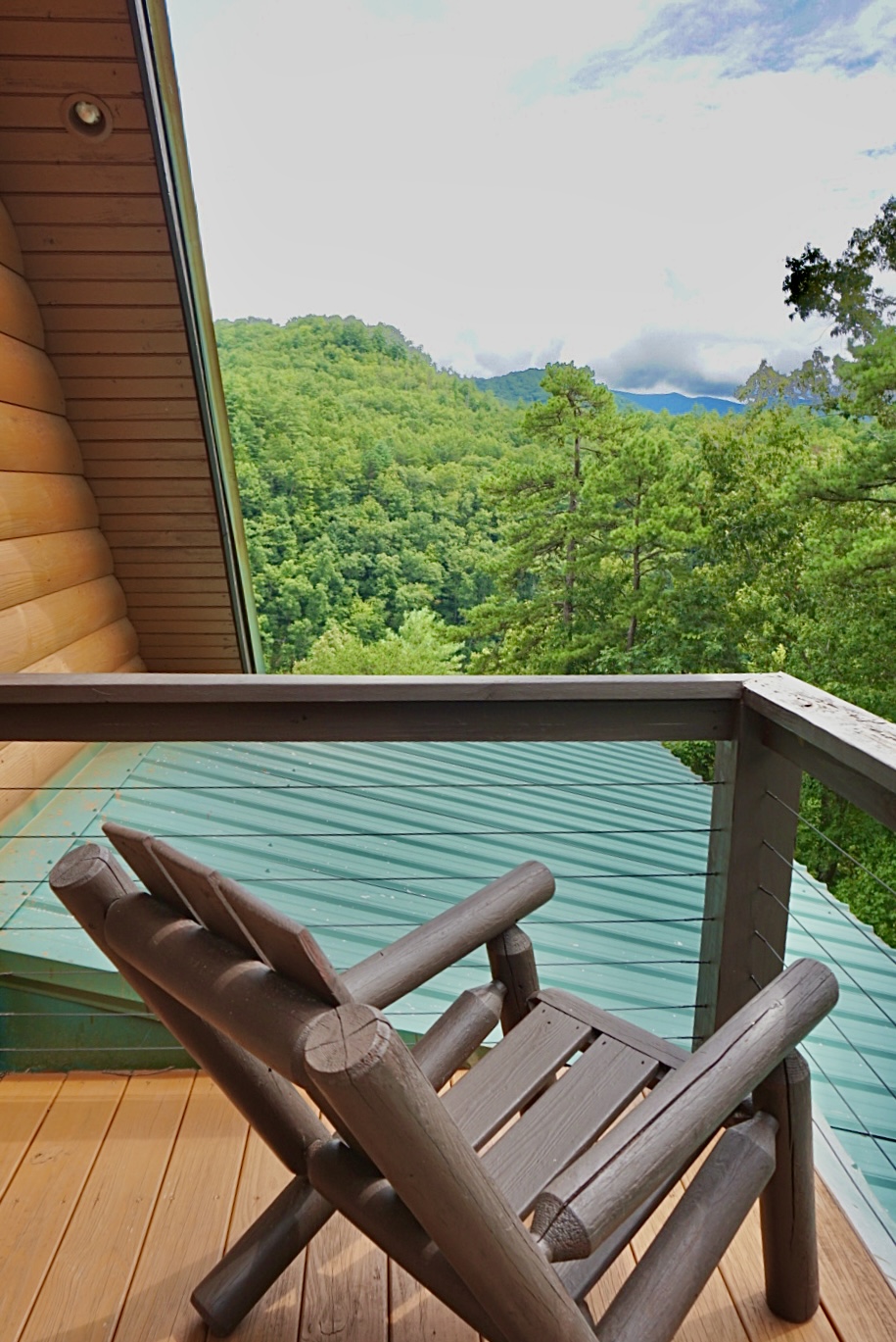 Balcony Retreat: Unwind on the deck with breathtaking mountain views and fresh forest air!