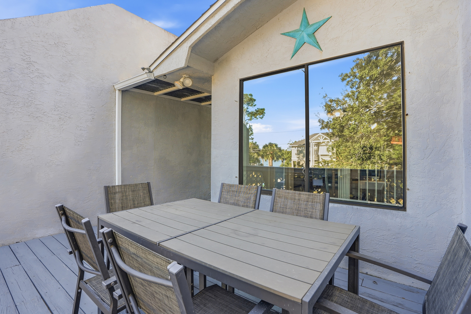 Front Balcony with Views of Grand Lagoon and Outdoor Seating