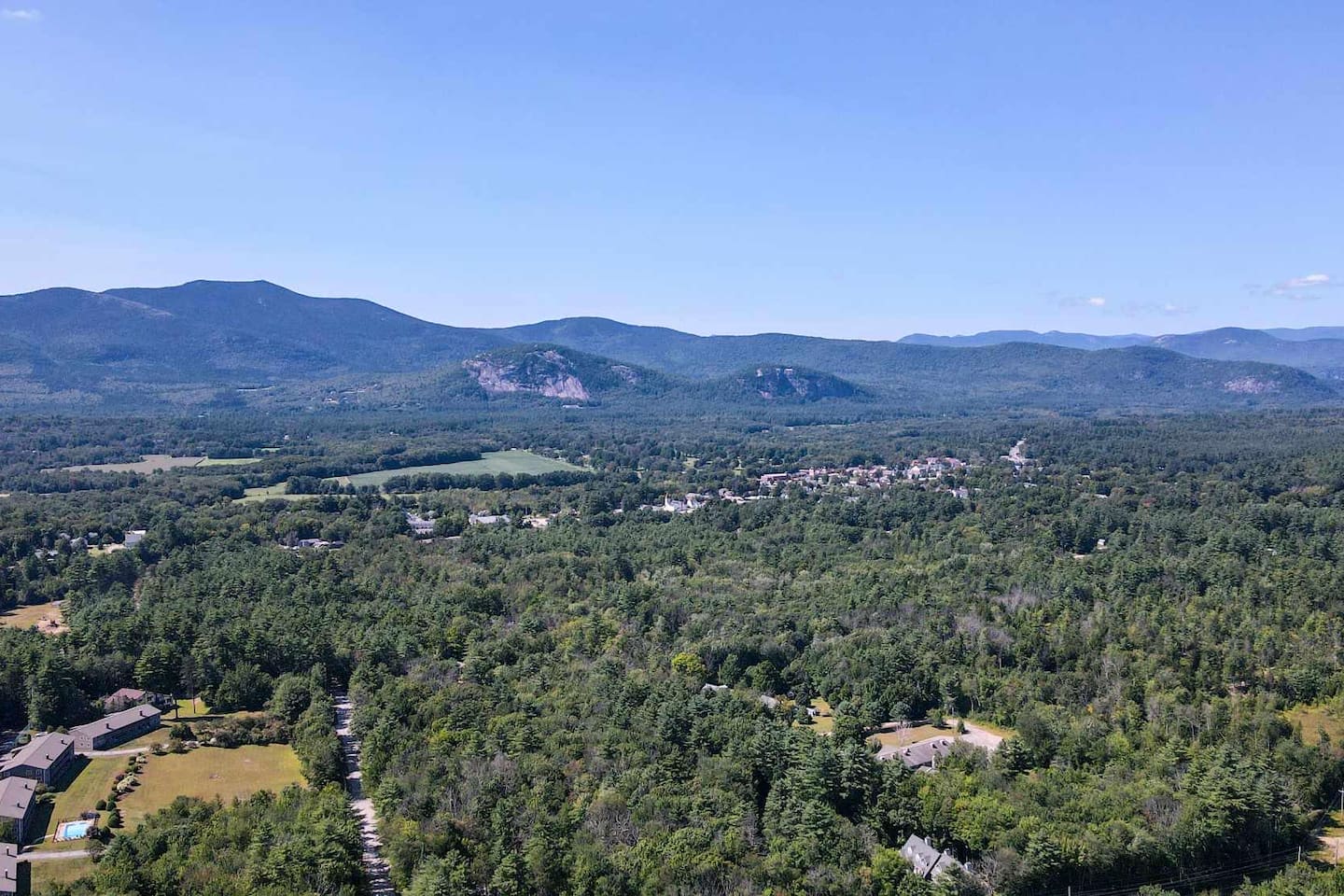 Drone shot from backyard showing how close downtown North Conway is