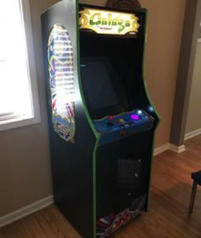 Vintage stand up video game with 60 old school games like Galaga, Centipede, all the Pacmans, Donkey Kong, etc. Bringing back childhood memories and adding some for the kids. 