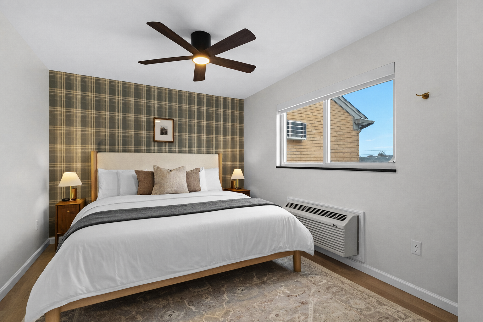Serene bedroom with a plush bed, ceiling fan, and calming décor—designed for restful sleep, cozy nights, and bright, refreshing mornings.