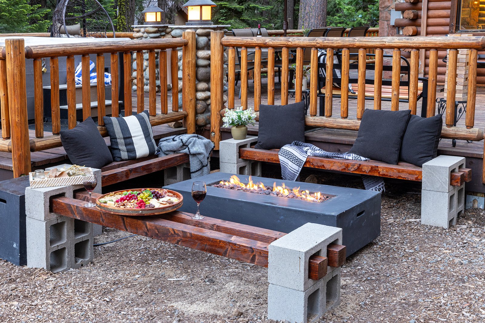 Pull up a bench and let the kids roast while the grown-ups linger — the fire pit is where this house comes together at night.