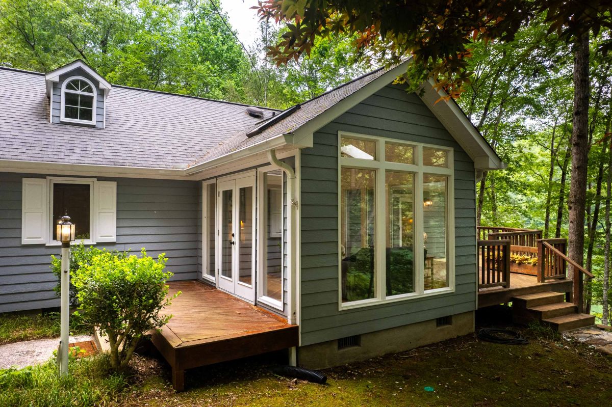 Sunlit Deck Retreat: Enjoy serene forest views from your spacious outdoor living area!

