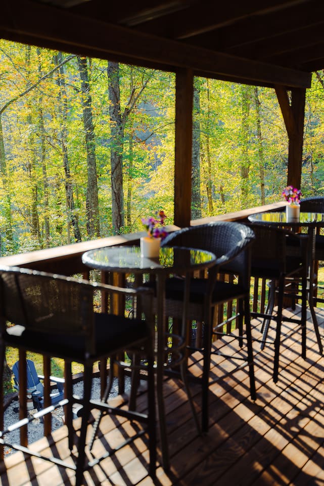 Enjoy a quiet moment at the outdoor dining table, surrounded by nature.