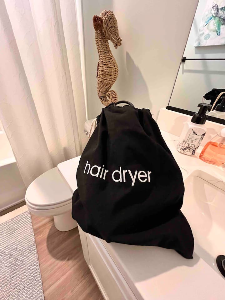 Hair dryers in both bathrooms.