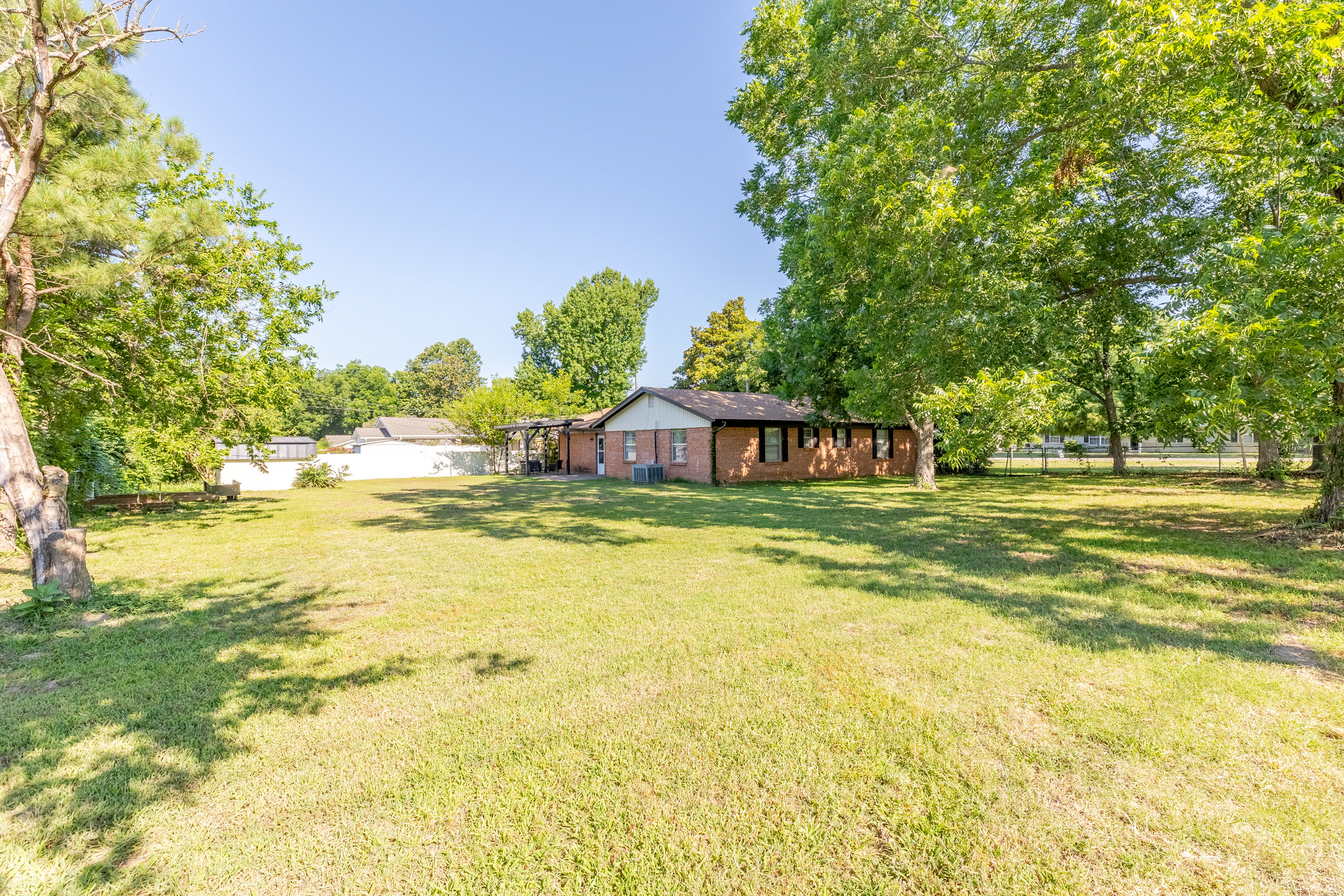 Spacious fenced yard for relaxation and play.