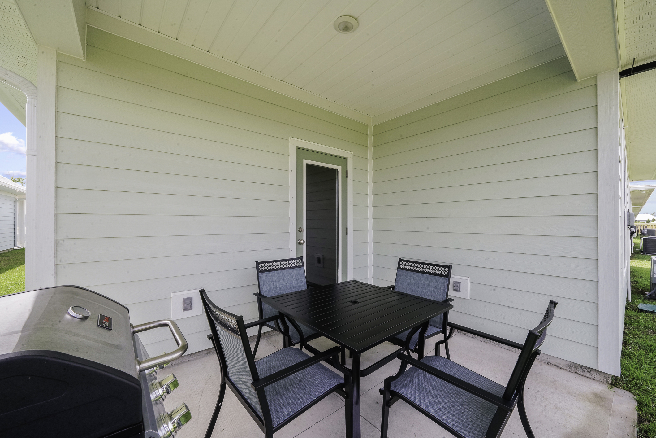 Spacious outdoor setting with Propane Grill, designed for dining, relaxing, and making memories with Friends/Family