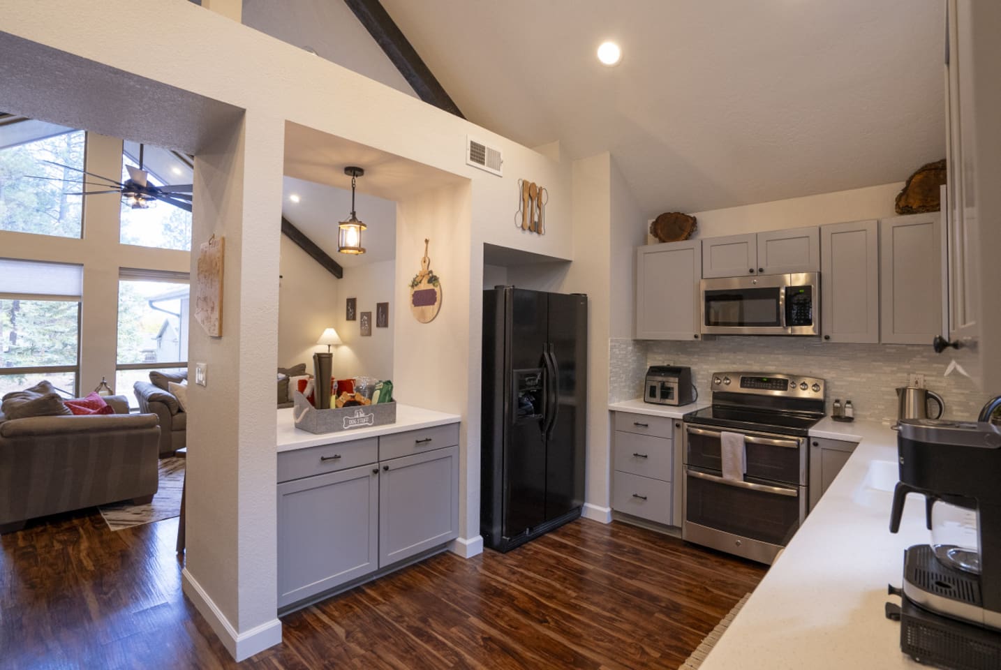 Kitchen view with full-size appliances, extra counter space, and open access to the living area.