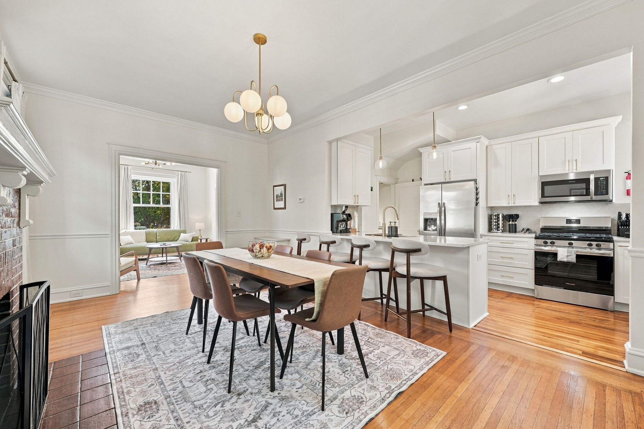 Dining Room: Stylish dining space with elegant lighting and a view of the inviting living area!