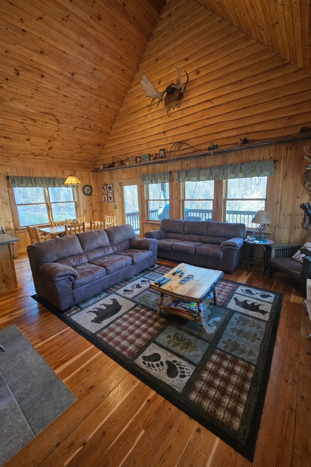 Comfortable living room after a full day. Coffee table has been updated to an ottoman with trays.