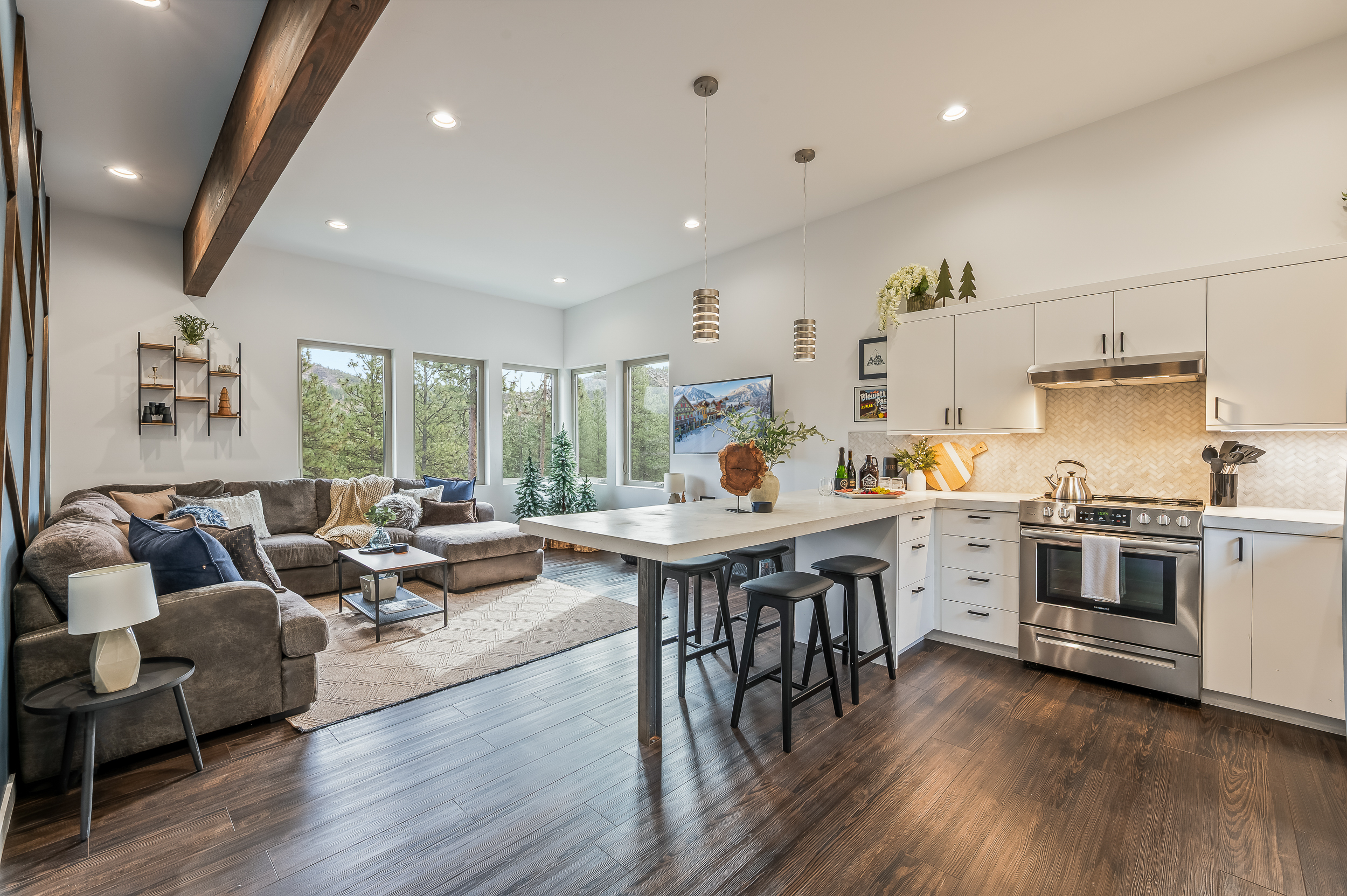 Spacious open layout with living room, fully loaded kitchen, island with dining seating for 4