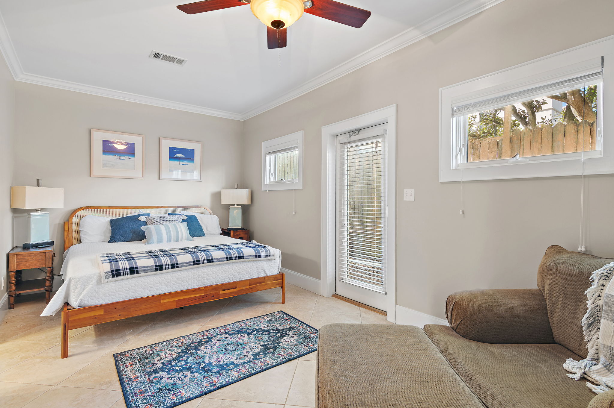 First floor bedroom with a king-sized bed has an attached bathroom. Perfect space away from the hub-bub for grandparents or couples that want a little extra privacy.