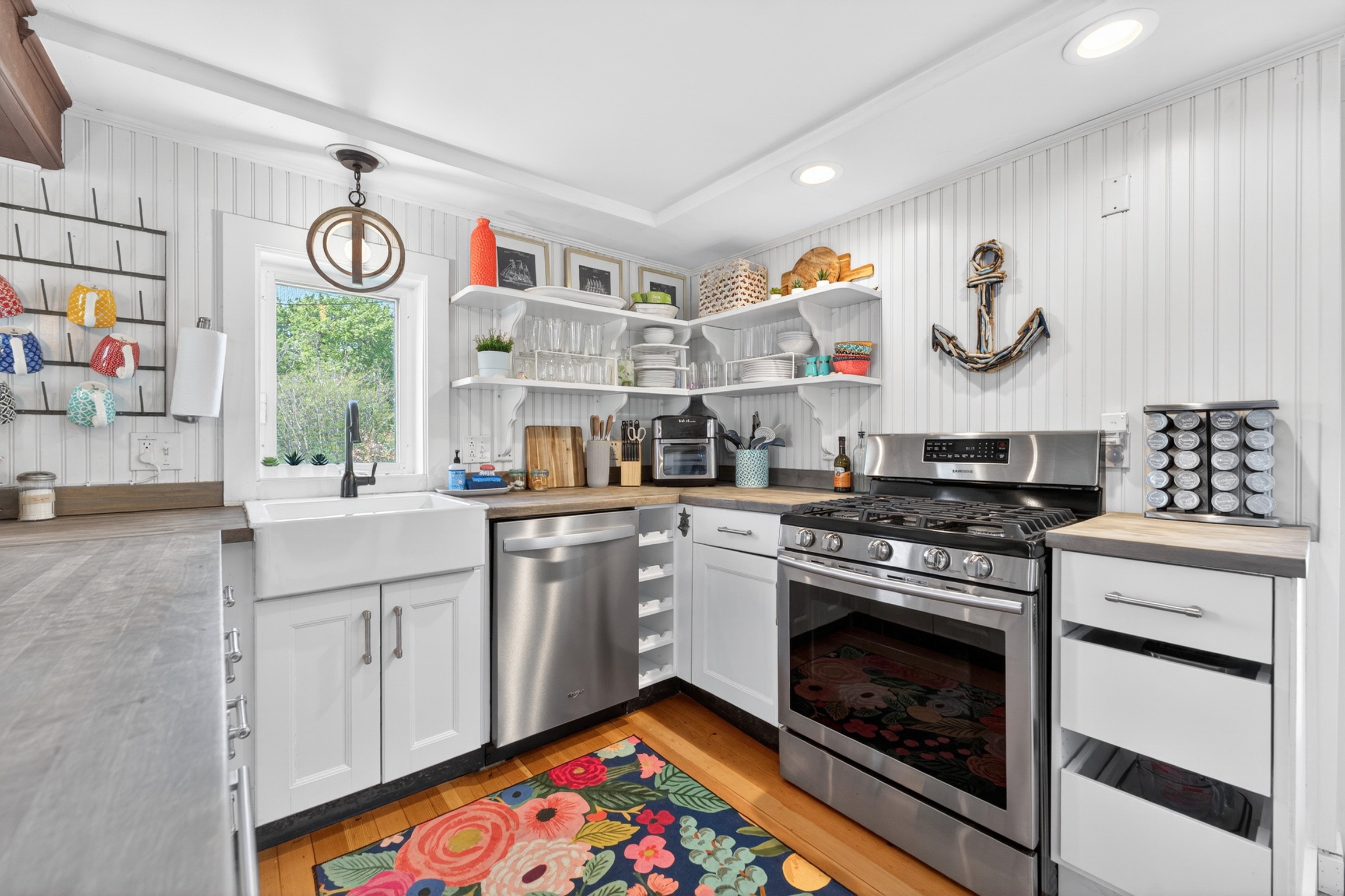 Fun and bright, this fully stocked kitchen has everything you need to prepare and enjoy meals at home.