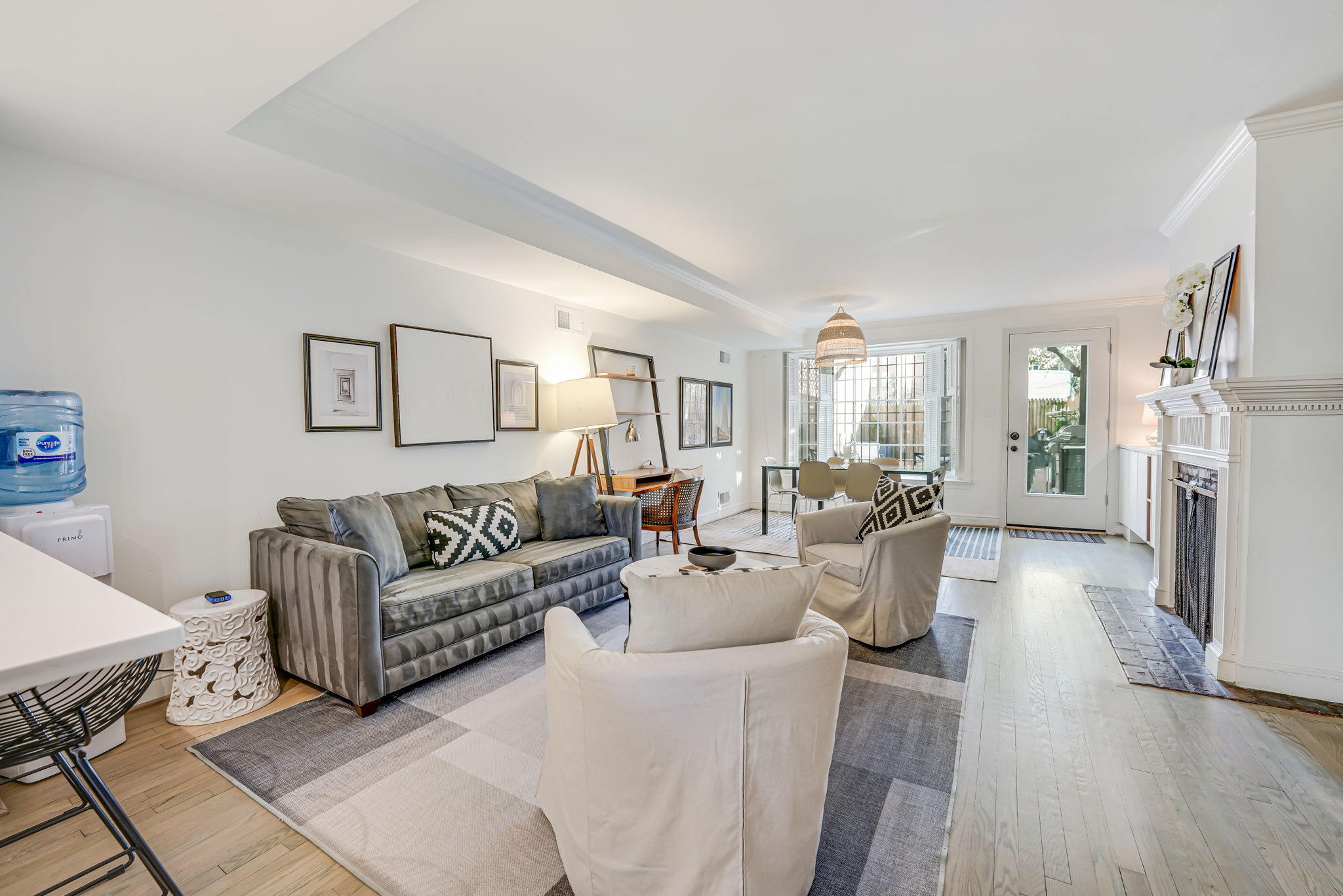 Living/Dining Room: Sleeper Sofa, Desk, Door to Patio, Free Parking, EV Charging.