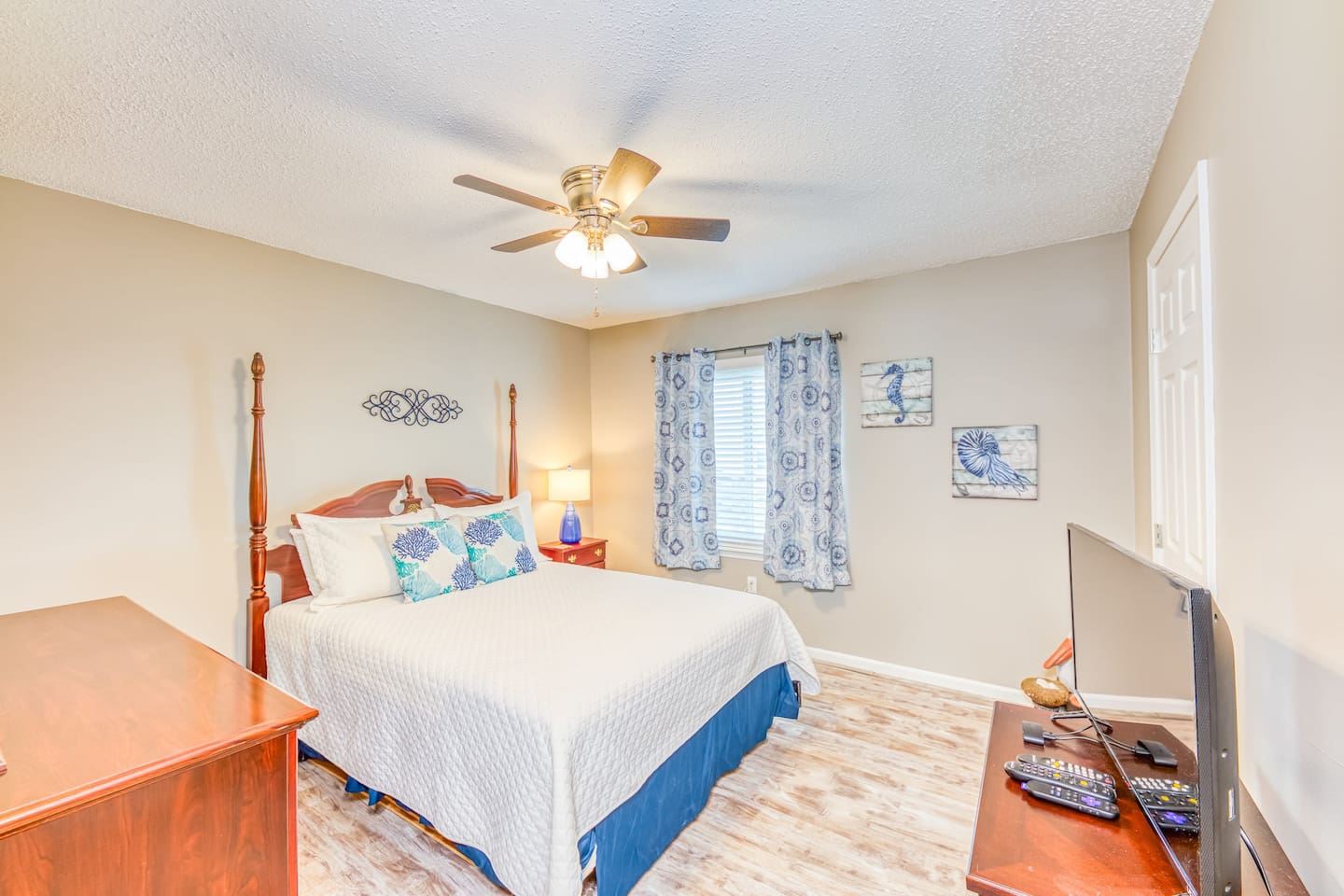 Master Bedroom: Relax in style with vibrant decor, a comfy bed, and lovely natural light!