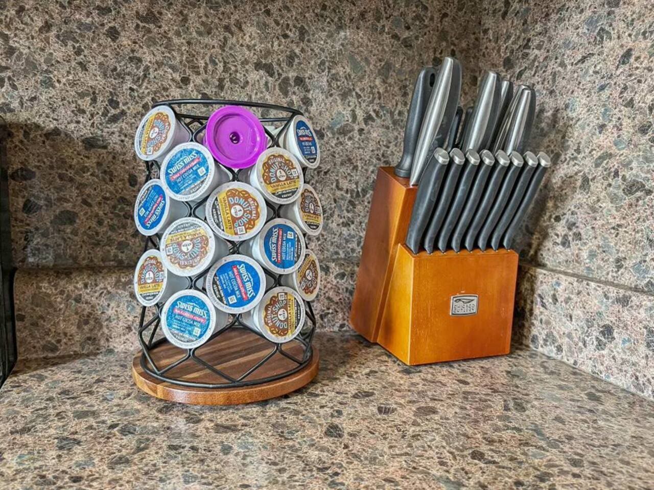 Well-equipped kitchen with a knife set for precision cutting and coffee capsules for your perfect brew.