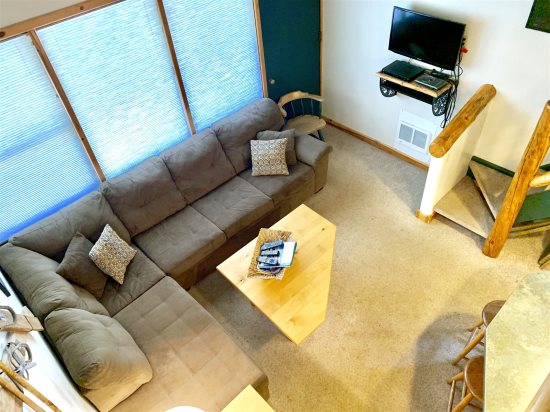 Over-head view of living room from loft area