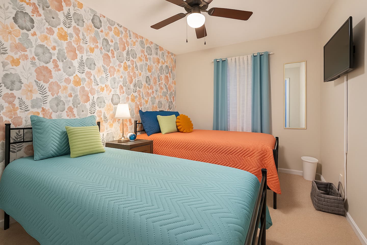 A playful and cozy twin bedroom, ideal for kids, friends, or additional guests, with a fun floral accent wall.