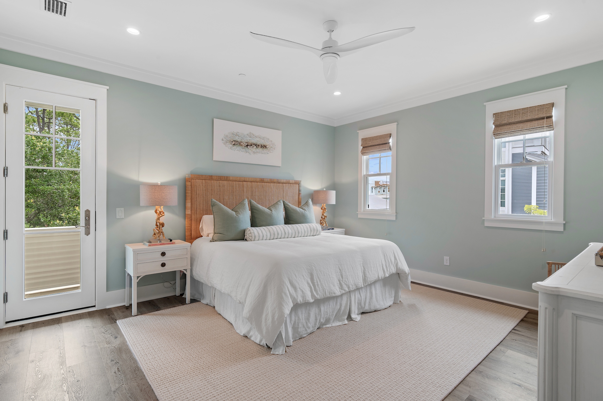 This large bedroom offers tons of natural light, as well as access to the rear balcony.