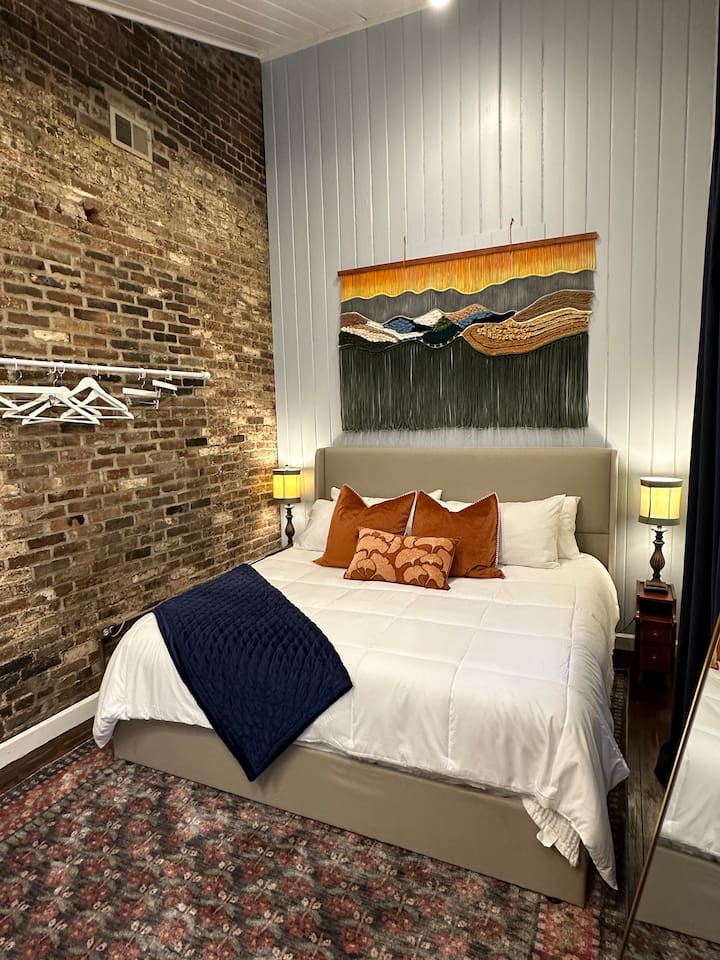 Artisan-made Textile art in the Boho Room. King bed with new Nectar mattress. 