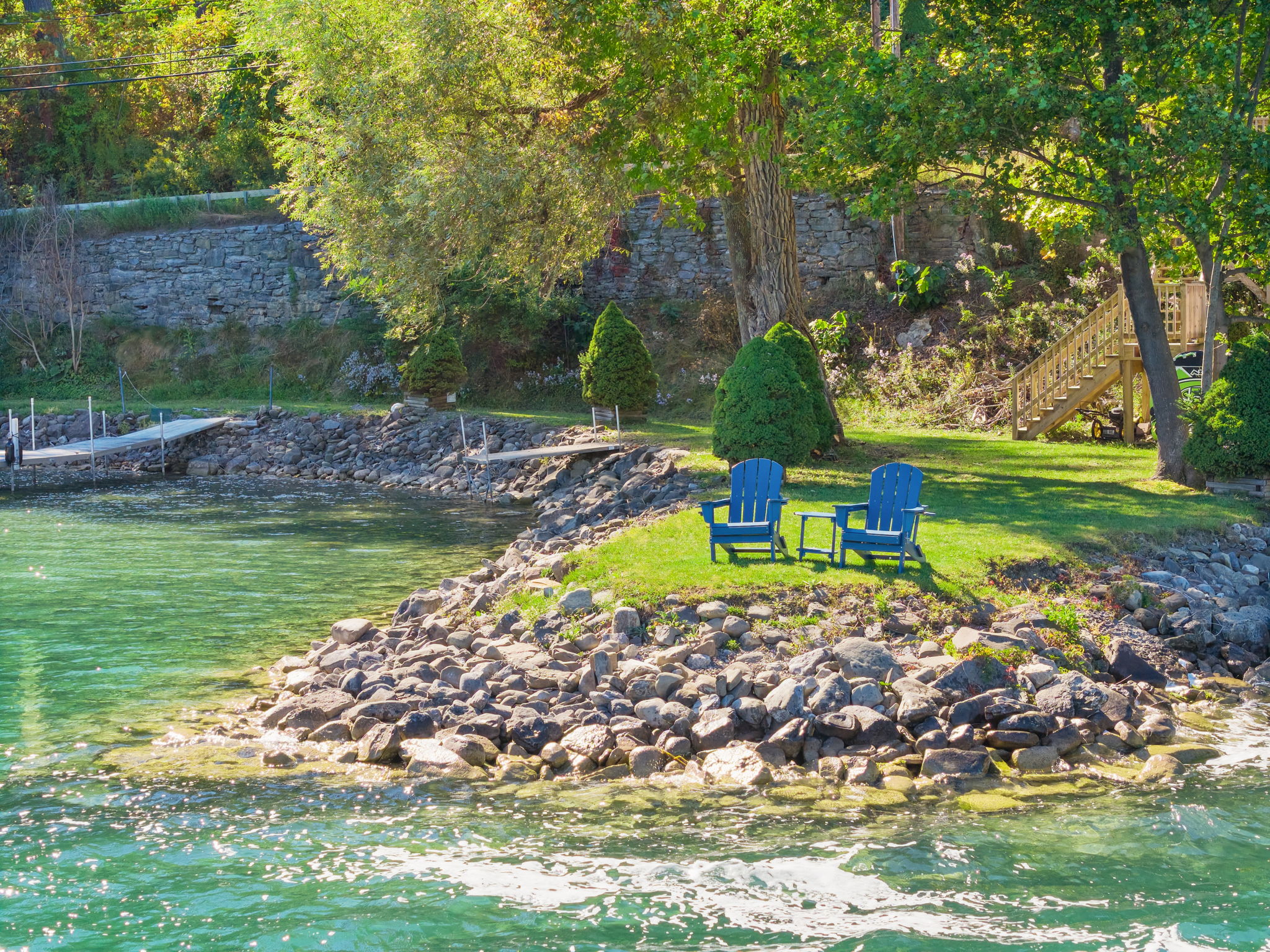 Otsego Lake's stunning summer beauty. Shared waterfront with paddleboards and kayaks