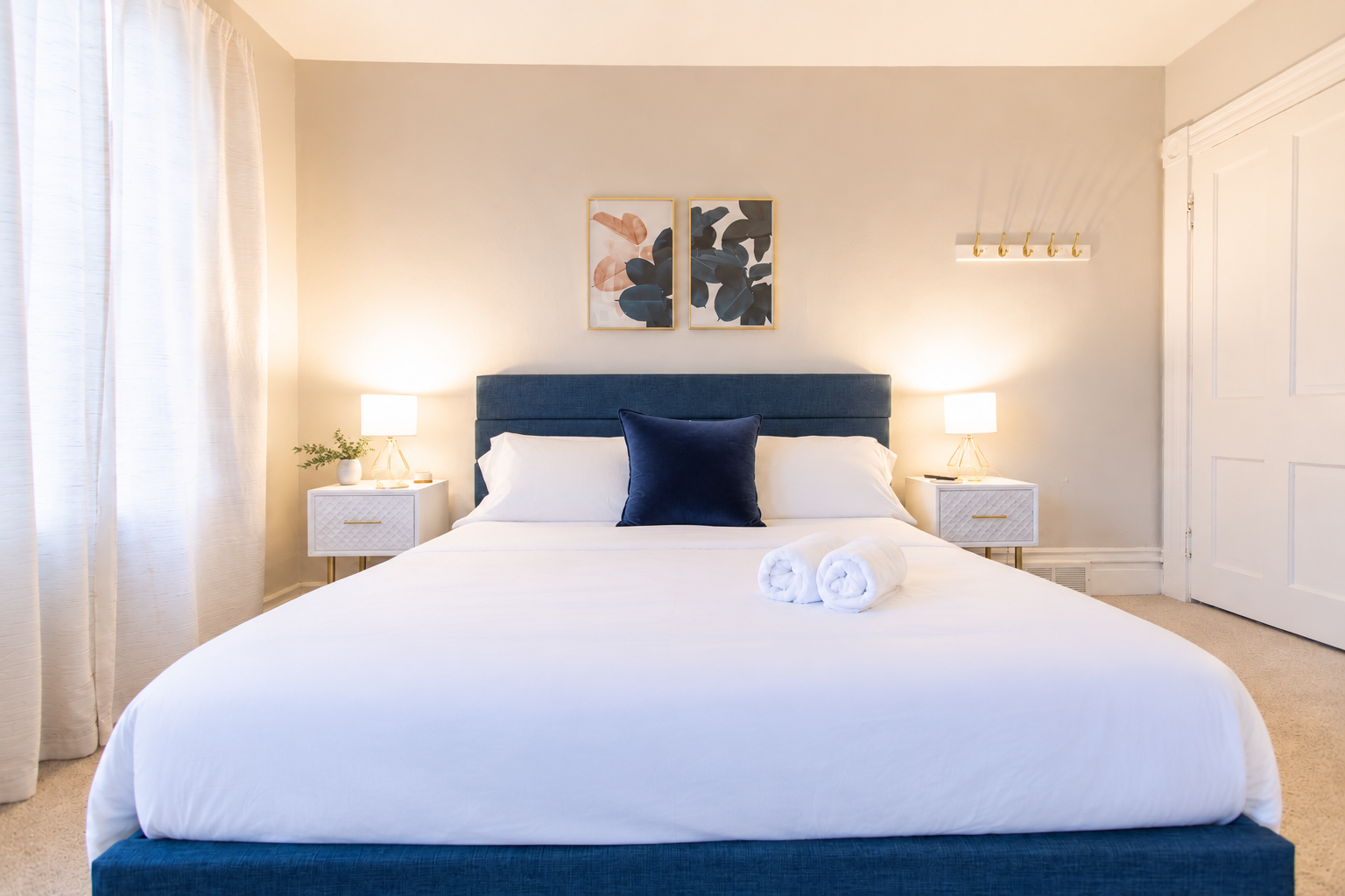 Discover the King Bedroom, a spacious room on the second floor with king bed flanked by nightstands with lamps.