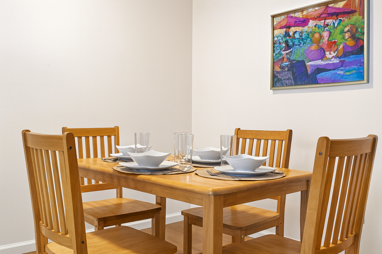 Gather around this sleek dining table, beautifully set for your stay.
