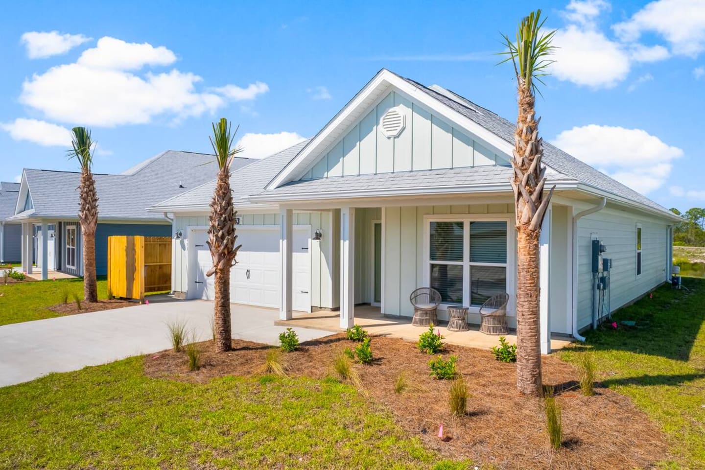 Relax on the balcony while enjoying views of the landscaped front yard.