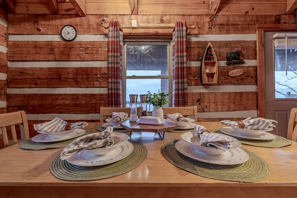 Table set for six with cabin decor