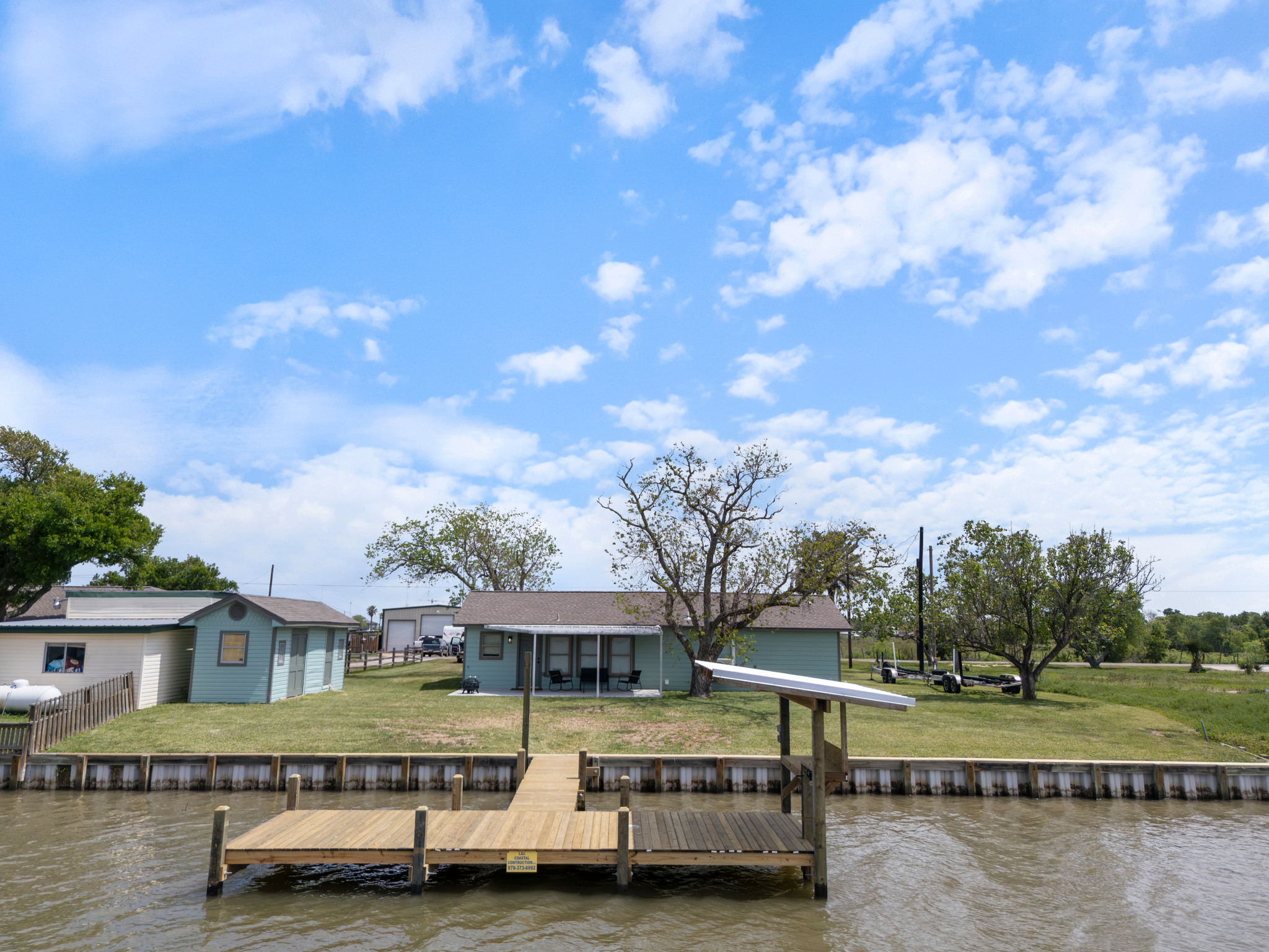 View of pier and backyard from the creek.