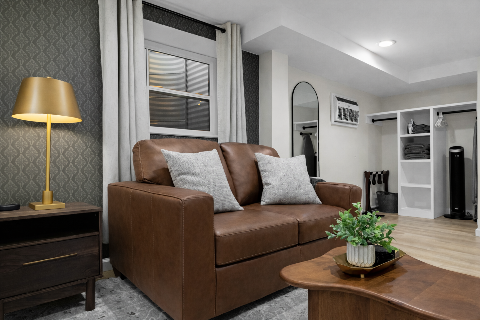 Cozy lounge area with comfortable leather seating, warm accent lighting, and stylish details—an inviting spot to relax, unwind, and feel right at home.