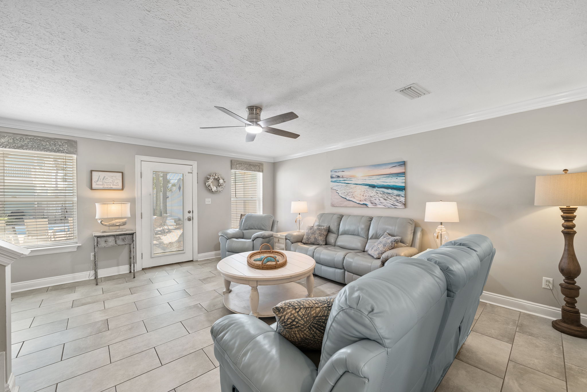 Comfy living room with plenty of seating! Gorgeous pool right outside the door.